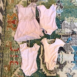 Set of 4 pink/blush dance leotards. 2 Capezio, 1 Bloch (w skirt), 1 Danskin